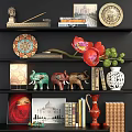 Stylish Decorative Ornament Set With Elephant Figurines Decorative Plates Vases Books And Orchid On Shelves