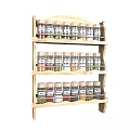 Neatly Arranged Spice Bottles On Wooden Three Tier Shelf For Kitchen Organization