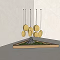 Round Yellow Pendant Lights Above Wooden Triangular Tray With Moss And Stone In Soft Light
