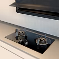 Modern Kitchen Interior Featuring Black Range Hood Cooktop And White Cabinets Appliances