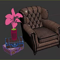 Brown Leather Tufted Armchair With Suitcase Side Table And Green Plant