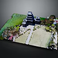 Detailed Traditional Japanese Castle Model With Green Landscape Trees Pathways And Garden