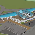 Large Public Building With Blue Roof Glass Structure Circular Paved Area Parking Lot And Trees
