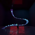 Curved Glowing Installation In Dark Space With Small Lights And Person Standing