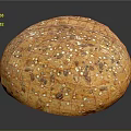 Fresh Round Multigrain Bread Loaf Topped With Sesame Flax And Sunflower Seeds
