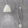 Sleek Modern Wall Lamp With White Shade And Adjustable Metal Arm On Gray Textured Wall