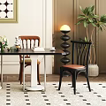 Black Modern Dining Table Set With Four Chairs Decorative Artworks Floor Lamp And Green Plant