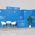 Blue Exhibition Booth Mockup With White Chairs Table And Green Plant