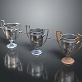 Three Elegant Trophies with Silver Gold Handles Engraved Details and Reflective Bases on Black Surface