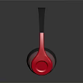 Modern Headphones with Black Headband and Red Black Ear Cups on Black Reflective Surface