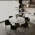 Round White Dining Table Set With Black Chairs And Green Plant In Modern Kitchen Interior