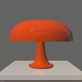 Orange Table Lamp With Round Shade And Red Base On White Pedestal