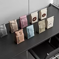 Assorted Colorful Coffee Bags Display On Black Table With Brand Labels