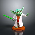 Green Yoda Toy Figure With White Robe Orange Outfit And Green Lightsaber On Orange Base