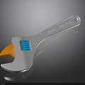 Adjustable Wrench With Orange Jaw Blue Spring White Handle And Reflection On Dark Surface