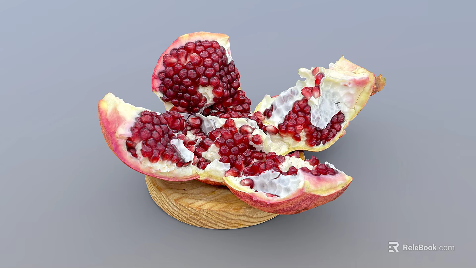 Fresh Cut Pomegranate With Red Juicy Arils On Wooden Plate 3d model 
