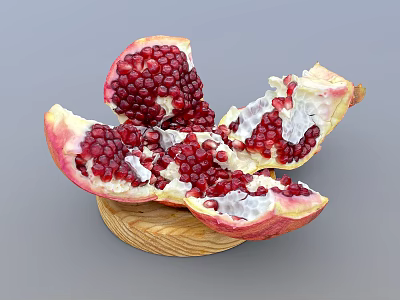 Fresh Cut Pomegranate With Red Juicy Arils On Wooden Plate 3d model