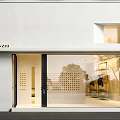 Modern Commercial Storefront Facade With Glass Doors And White Wall Design