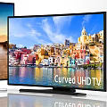 SUHD and Curved UHD Televisions Displaying Sunset Coastal Scenery and Colorful City Buildings