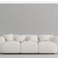 Modern Minimalist Three Seater Sofa With Neutral Colored Plush Cushions And Curved Armrests
