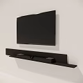 Wall Mounted Black Television With Wooden TV Stand And Soundbar Speakers