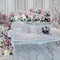 Elegant Floral Art Decoration With White Sofa Various Flowers Green Plants And Candles