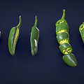 Fresh Green Chili Peppers Whole And Sliced Showing Inner Seeds