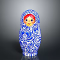Traditional Matryoshka Doll With Blue White Floral Patterns And Red Hair