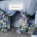 Elegant Photo Spot With Light Blue Arch Curtains And Blue White Floral Decorations