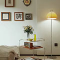 Stylish Side Table with Wooden Shelf Silver Frame and White Flower Vase Near Floor Lamp