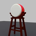 Traditional Red and White Circular Drum with White Drumhead on Wooden Stand
