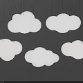 Cloud Shaped Chandeliers in White and Light Green Hanging on Gray Wall