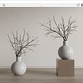 White Ceramic Vases With White Flowering Branches On Wooden Cubes Against Light Wall