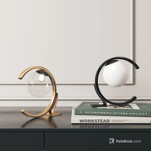 Modern Table Lamps with Gold Black Arc Metal Frames and Glass Globe Shades on Books 3d model 
