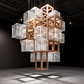 Modern Sculptural Installation With Wooden Frame And Transparent Glass Cubes In Black Exhibition Space
