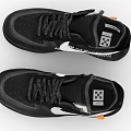 Black Low Top Sneakers With White Nike Swoosh Black Laces Black Sole And Orange Accents