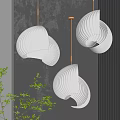 Modern Curved Ribbed White Pendant Lights With Warm Light Grey Wall And Green Plants