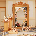 Elegant Photo Spot With Ornate Gold Frame Mirror Fresh Flowers And Decorative Pedestals