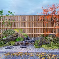 Traditional Karesansui Garden With Bamboo Fence Rocks Red Green Trees And Fallen Leaves