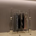 Modern Metal Garment Rack With Spherical Accents And Square Bases Holding Various Colored Clothes