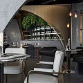 Modern Café Arched Architecture Gray Walls Hanging Lamps Green Plants Tables Chairs In Open Space
