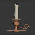 White Candle Placed On Copper Candlestick Holder With Base And Handle