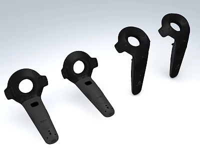 Four Black Plastic Mechanical Components With Circular Holes And Handle Shapes 3d model