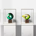 Decorative Ornament Set with Various Colors and Shapes in Glass Display Cases on Marble Bases