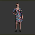 Woman in Colorful Floral Dress Standing with One Hand on Hip Against Gray Background