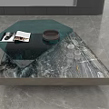 Modern Coffee Table With Green Glass And Marble Top Featuring Magazines And Bowl