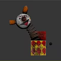 Clown Pop Up Toy With White Red Body In Red Yellow Checkered Box