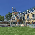 Unique Boutique Guesthouse Building with Blue Roof Yellow Facade Tower Arched Windows Lush Green Lawn