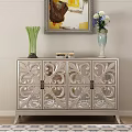 Ornate Console Cabinet With Carved Patterns And Decorative Vases Books Painting On Top