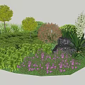 Colorful Garden Shrubs With Green Leaves Purple Flowers And Decorative Stone